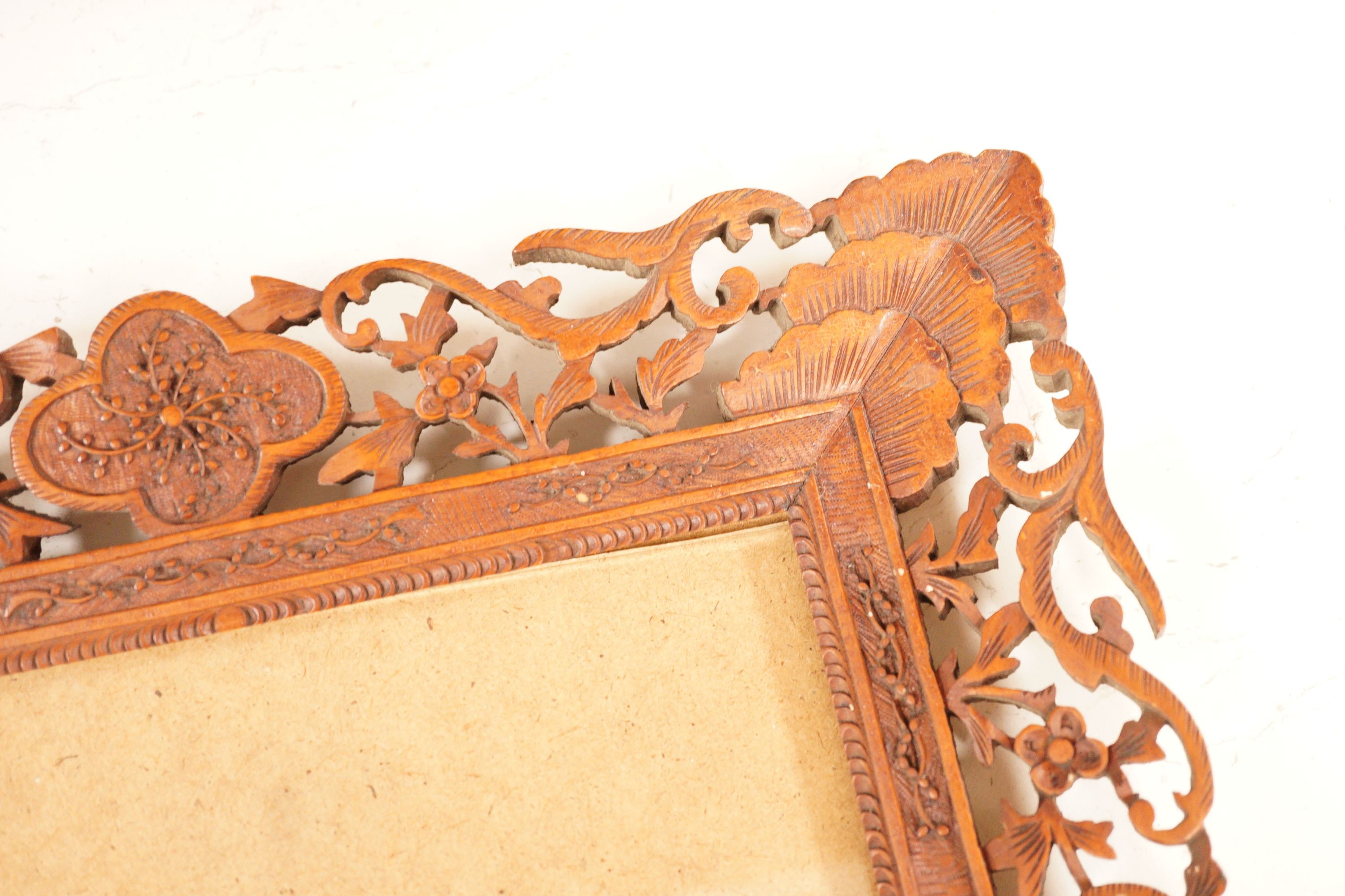 A Chinese carved sandalwood picture frame, 36x41 cm total